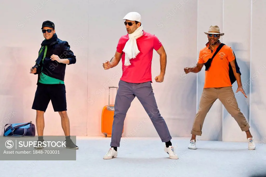 3 young men, models performing in the Spring and Summer Fashion Show 2012 in Pilatusmarkt in Kriens, Lucerne, Switzerland, Europe