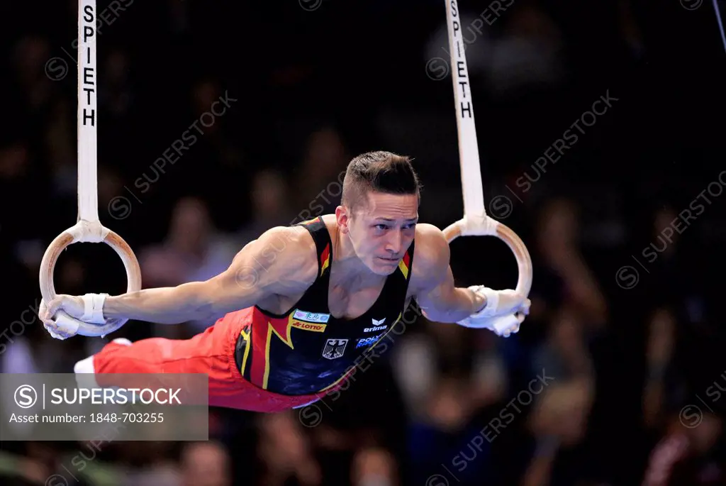Marcel Nguyen, GER, performing on still rings, EnBW Gymnastics World Cup, 11 to 13 Nov 2011, 29th DTB Cup, Porsche-Arena, Stuttgart, Baden-Wuerttember...