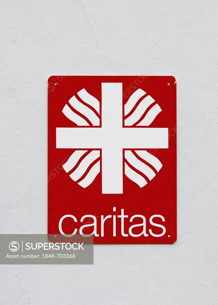 Sign, logo of Caritas, on a white wall, Deutscher Caritasverband e.V., Roman Catholic Caritas charity, Germany, Europe, PublicGround