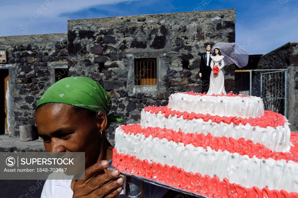 Woman carrying a wedding cake, Chí das Caldeiras, Plain of the Calderas, Fogo, Cape Verde, Africa