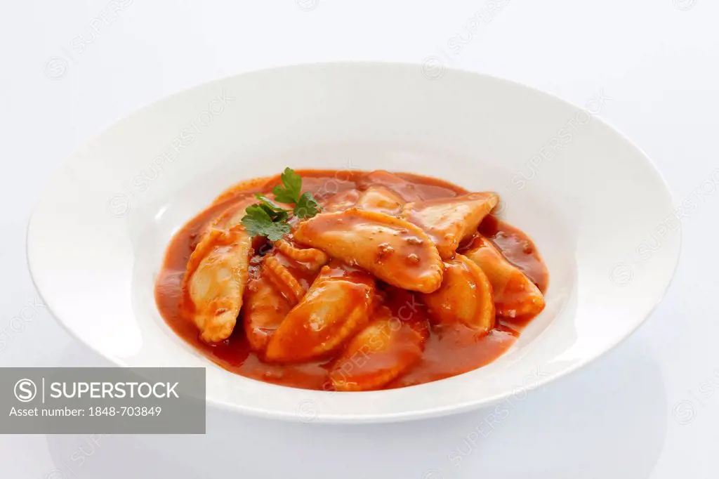 Canned ravioli on a white plate