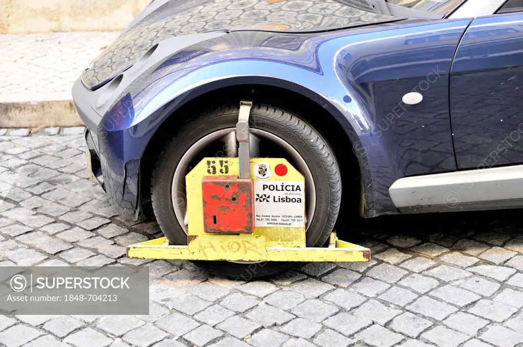 Car with a wheel clamp, car parked in a no-parking zone, Lisbon, Lisboa, Portugal, Europe