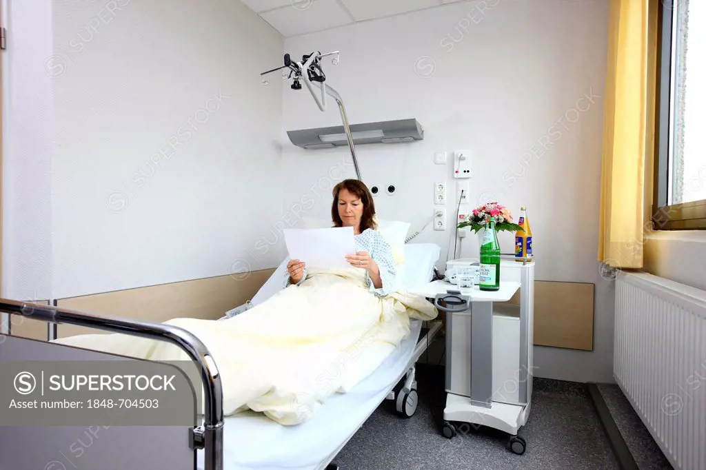 Patient lying in a hospital bed, hospital room, single room, hospital