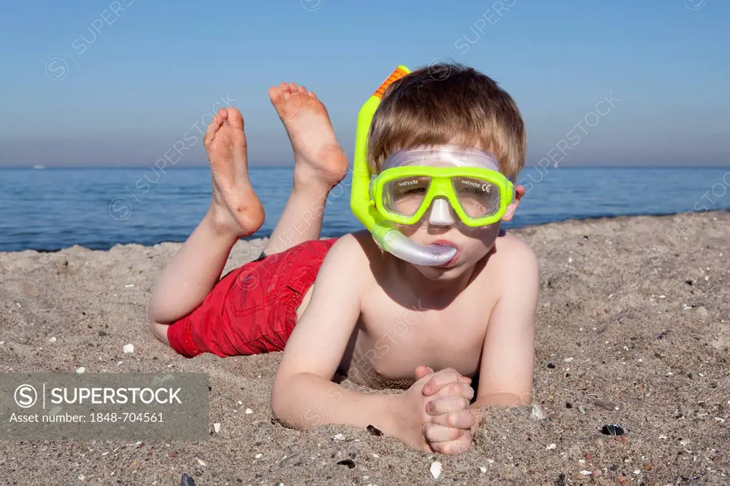 Young boy on a beach wearing diving goggles and a snorkel, Heiligendamm, Mecklenburg-Western Pomerania, Germany, Europe