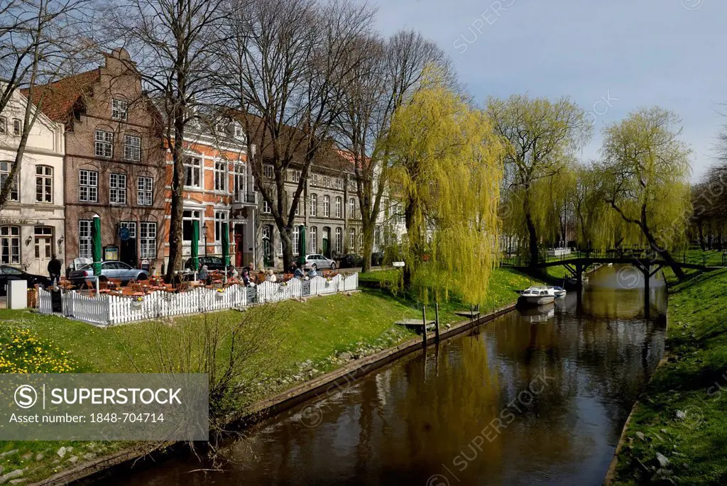 Canal and old brick buildings in the Dutch town of Friedrichstadt, North Friesland district, Schleswig-Holstein, Germany, Europe