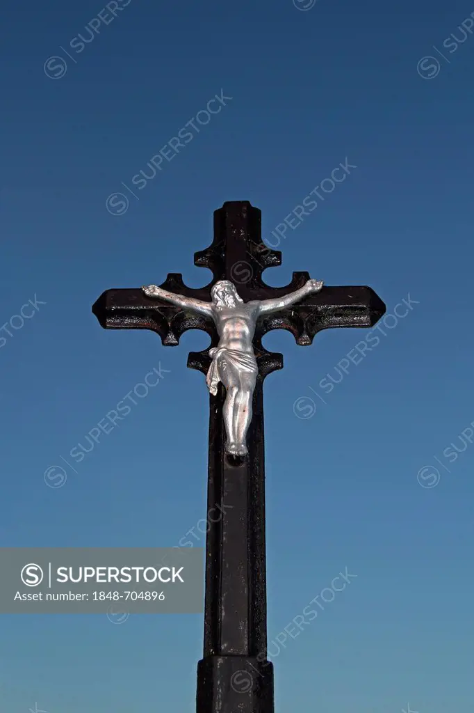 Crucifix against a blue sky