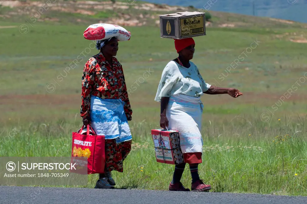 Elderly women carrying loads on their heads, Phuthaditjhaba, Free State, South Africa, Africa