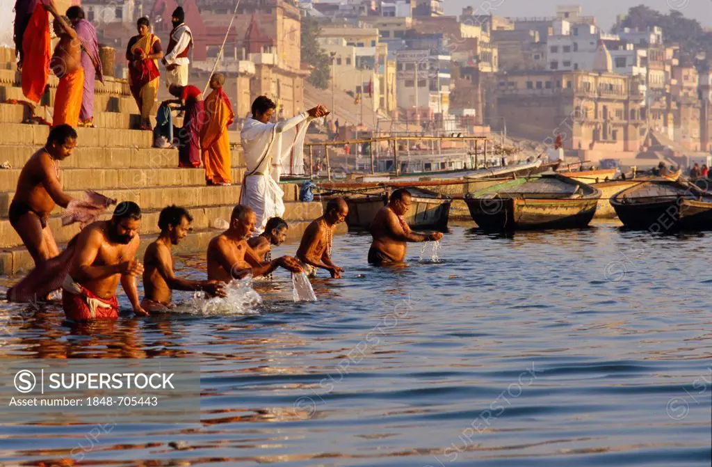 The ghats are busy with pilgrims every morning, Varanasi, Uttar Pradesh, India, Asia