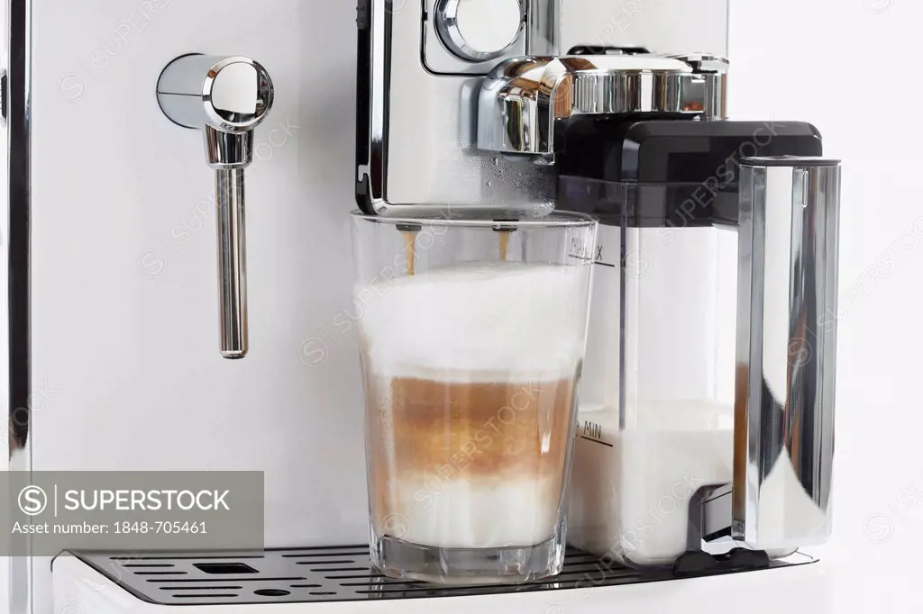 Latte macchiato being made on a coffee machine