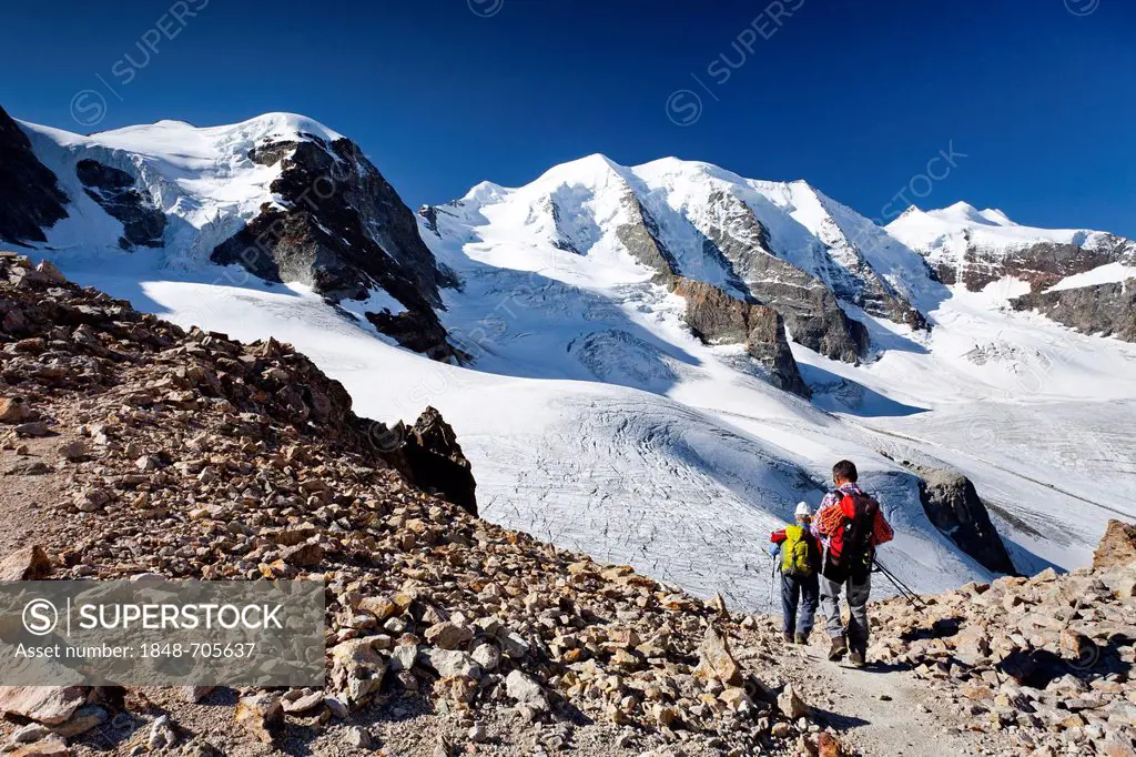 Mountaineers climbing Piz Palu mountain, at the back, Piz Cambrena mountain at the right, Bella Vista mountain at the left, Morteratsch Glacier in the...