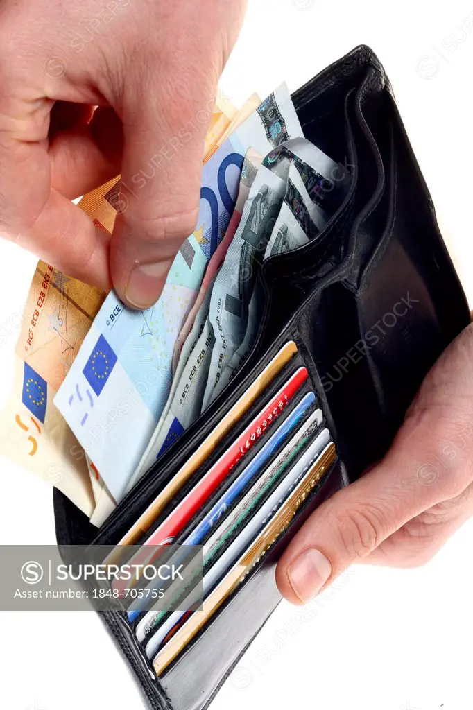Hands holding wallet with various credit cards, bank cards, euro notes