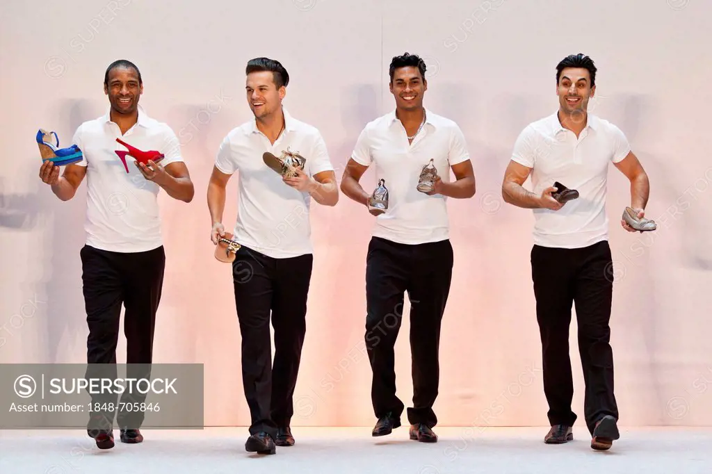 4 young men, models performing in the Spring and Summer Fashion Show 2012 in Pilatusmarkt in Kriens, Lucerne, Switzerland, Europe