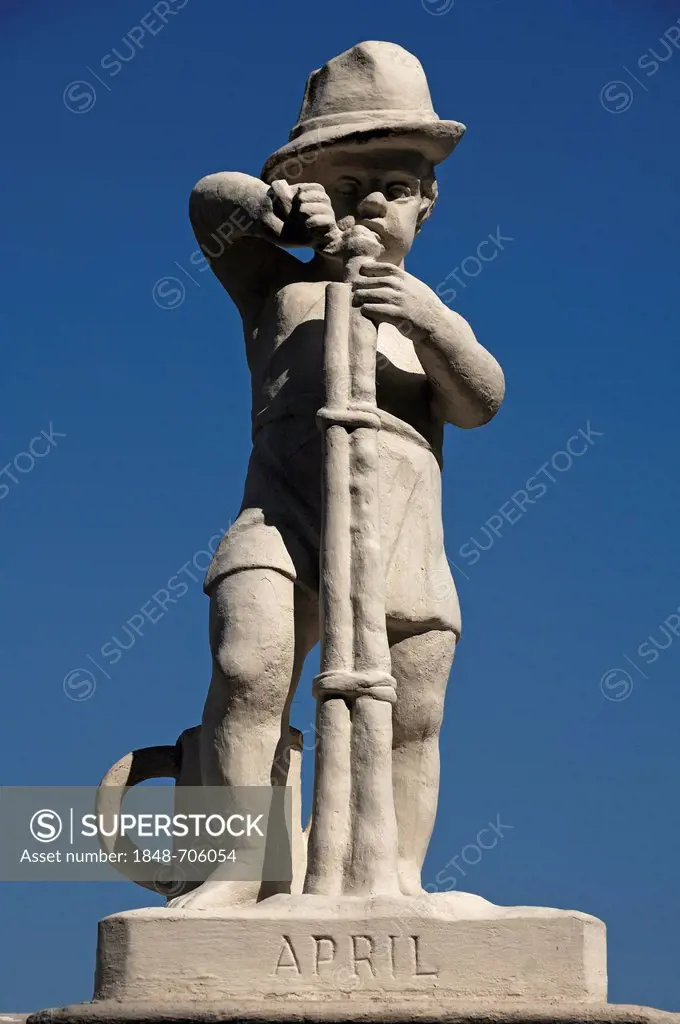 Statue of a child cutting a tree against a blue sky, symbol for the month of April, Oberes Schloss Belvedere palace, Prinz-Eugen-Strasse street 27, Vi...