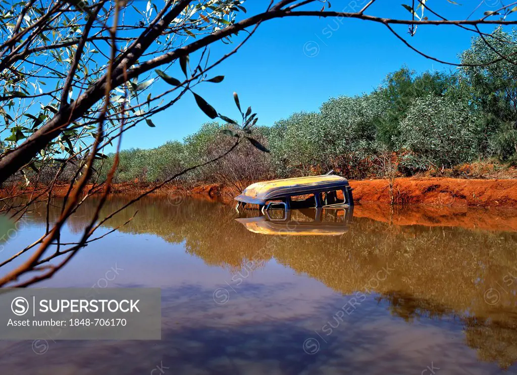 Old car wreck in a billabong, West Kimberley, Western Australia