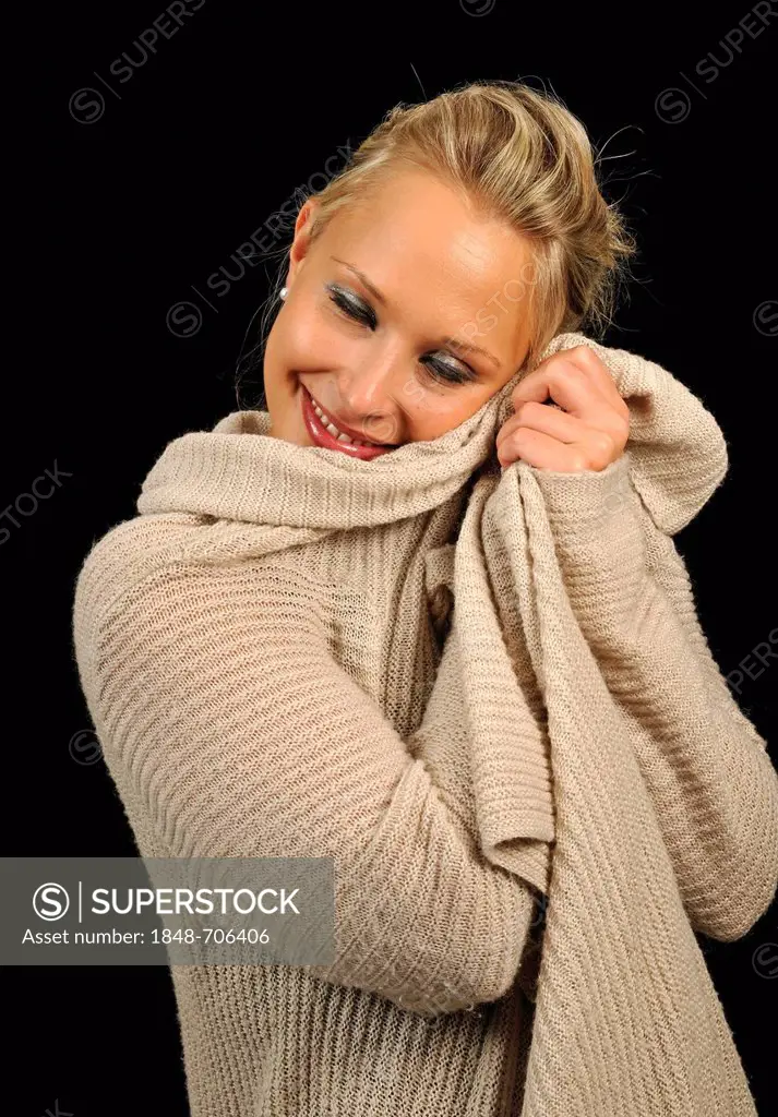 Young woman wearing a sweater, cozy