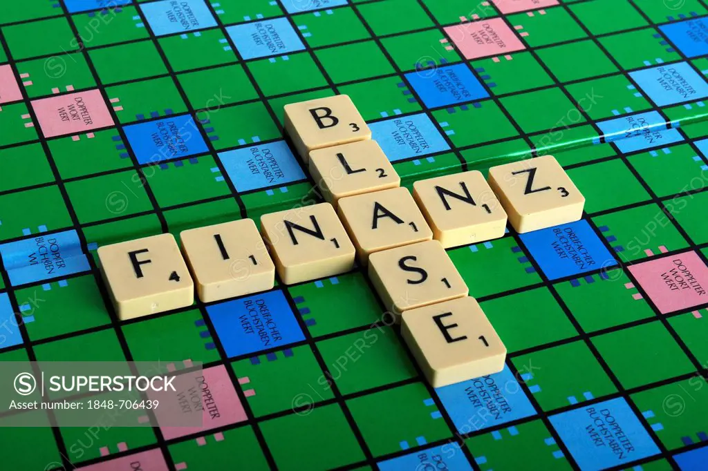 Scrabble letters forming the words Finanz and Blase, German for financial bubble