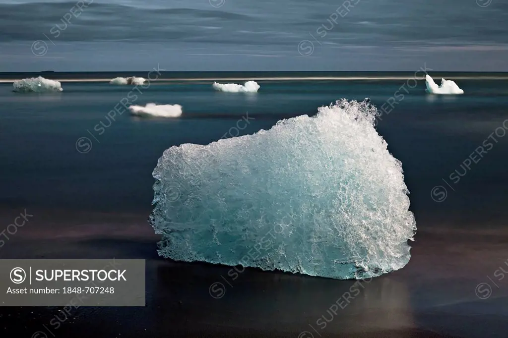 Small icebergs that break off the Vatnajoekull Glacier and float through the Joekulsarlon glacial lagoon towards the sea, frayed by salt water and was...