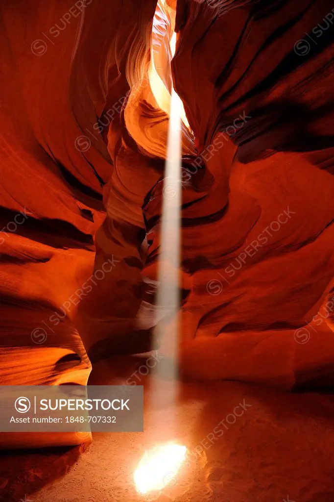 Beam of light, red sandstone of the Moenkopi Formation, rock formations, colours and textures in the Upper Antelope Slot Canyon, Page, Navajo National...