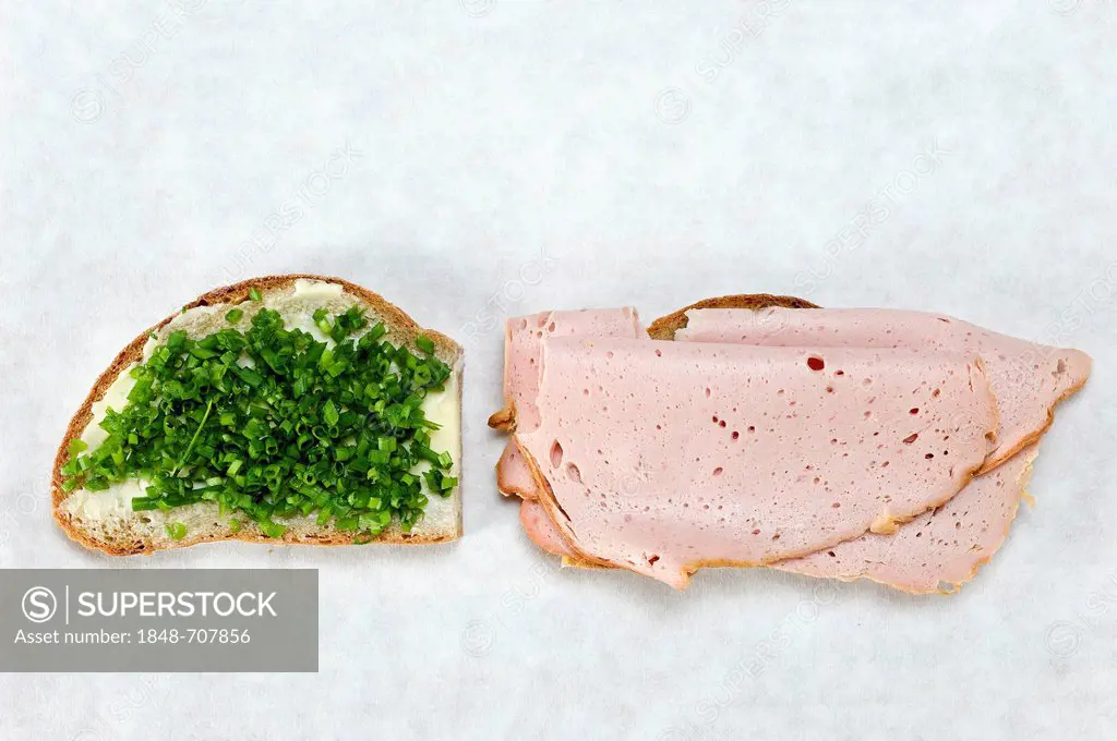 A slice of bread with chives and a slice of bread with a slice of meat loaf