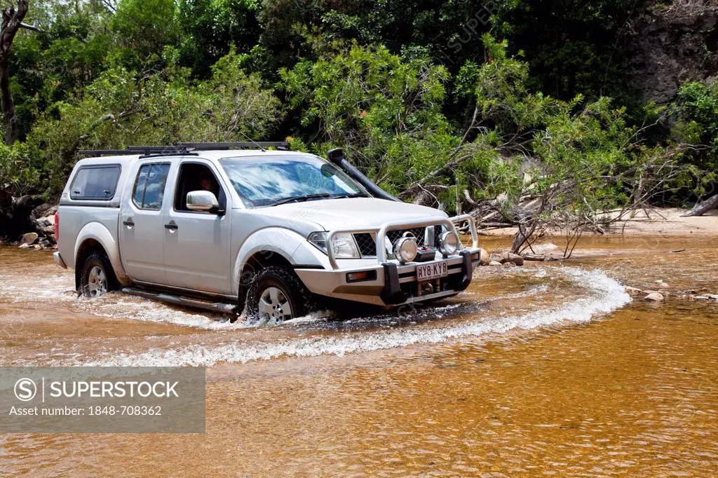Jeep crossing the Archer River, Cape York Peninsula, northern Queensland Australia