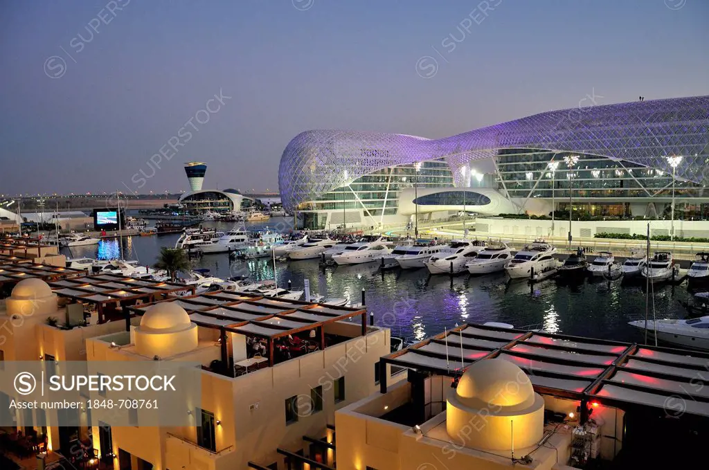 Yas Hotel and marina at the Formula One racetrack Yas Marina Circuit on Yas Island in the last daylight, Abu Dhabi, United Arab Emirates, Arabia, Asia