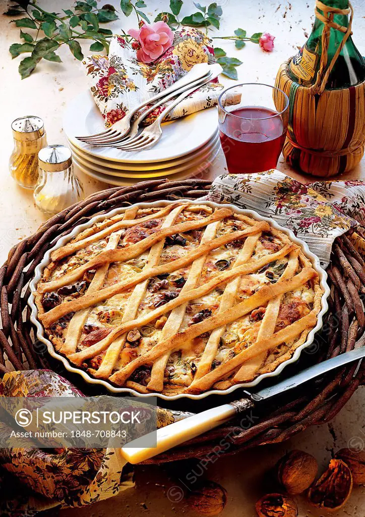 Cheese and walnut crostata, crispy pastry with nuts, cheese and garlic, Italy