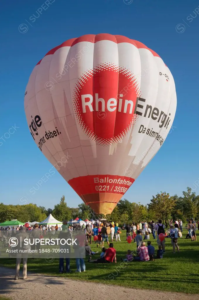 Moored balloon with a Rheinenergie logo before take-off, spectators, Rheinaue Bonn public festival, North Rhine-Westphalia, Germany, Europe