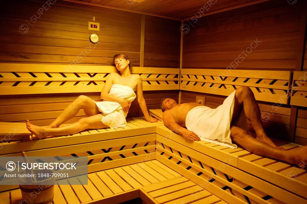 Couple in a sauna, woman, 35 years, and man, 54 years