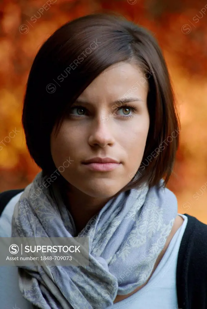 Portrait, standing young woman, sad