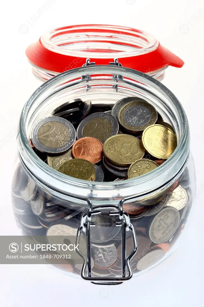 Jar used as a piggy bank with euro coins