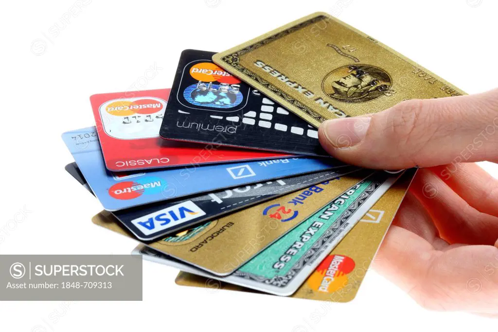 Hand holding a fan of of credit cards, bank cards