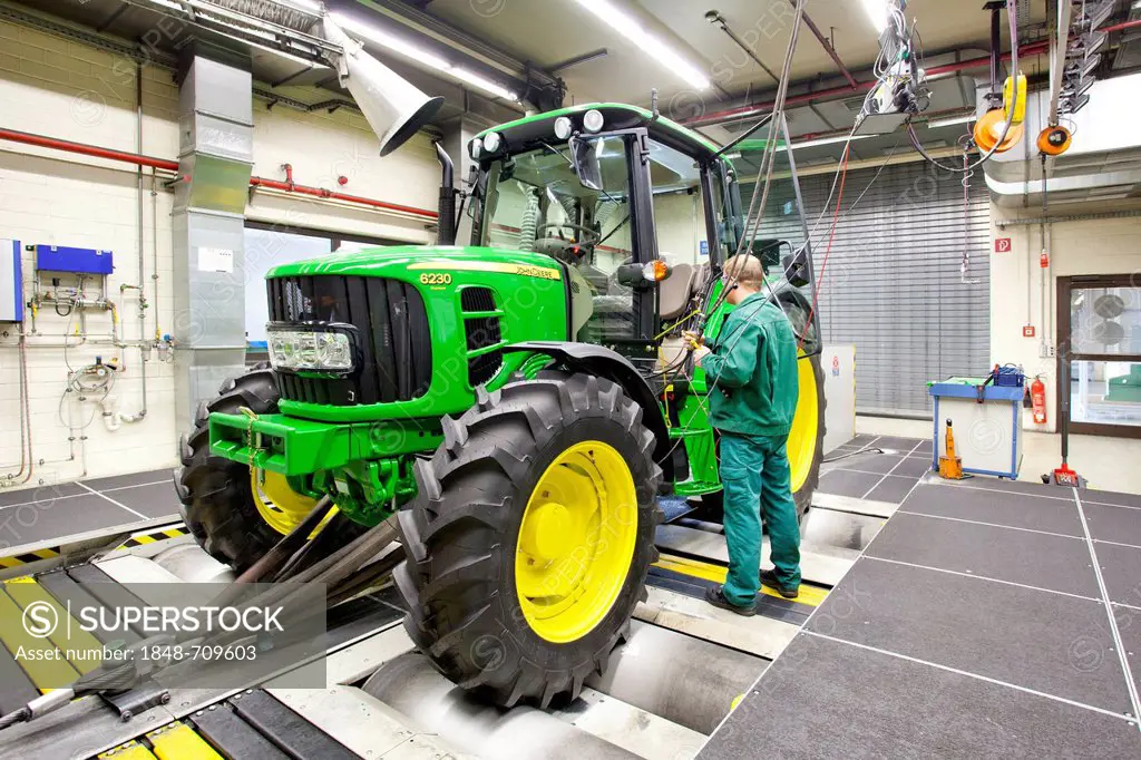 Setting up the test equipment at the test centre in the tractor production section at the European headquarters of the American agricultural machinery...