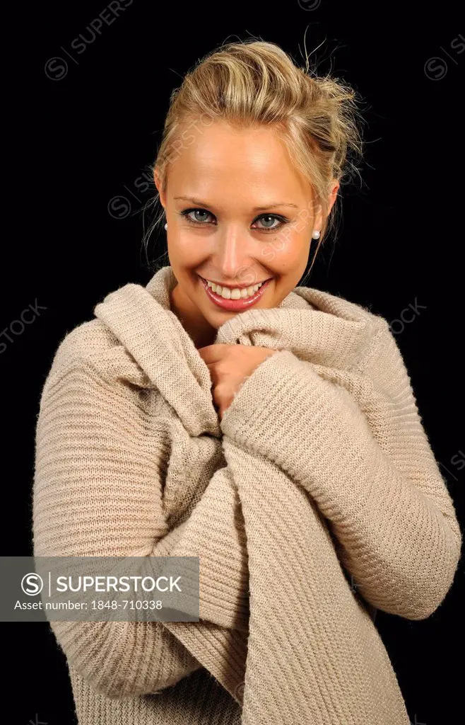 Young woman wearing a sweater, cozy