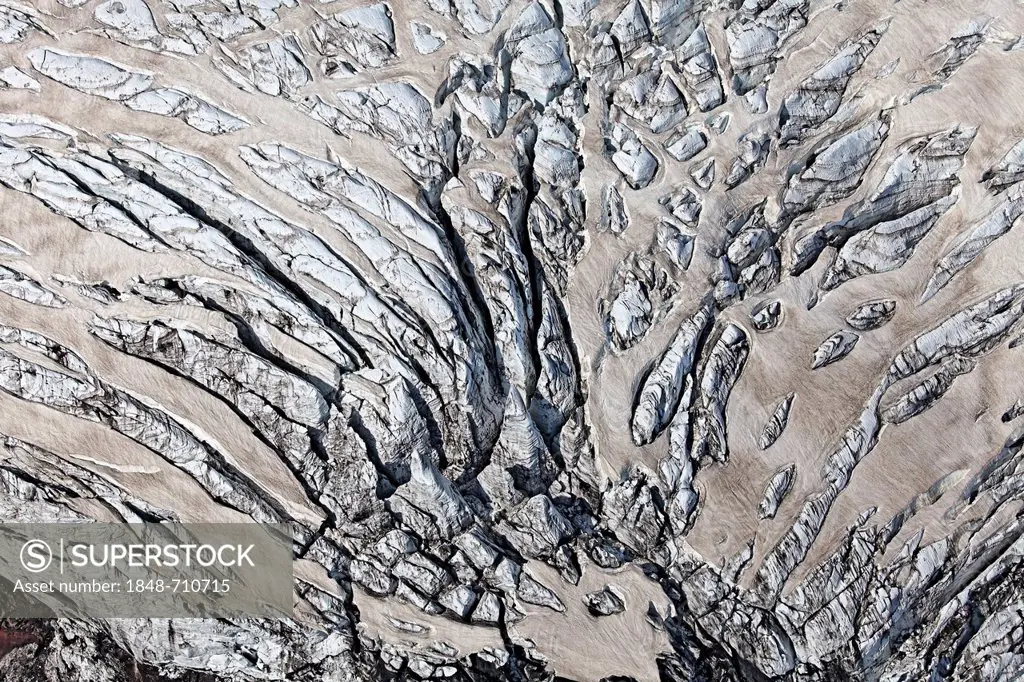 Aerial view, lines and structures formed by volcanic ash, lava and crevasses in the ice and snow of the Vatnajoekull glacier, Iceland, Europe