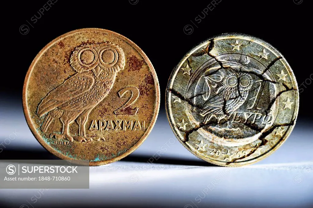 Greek drachma and a Greek one-euro coin with cracks