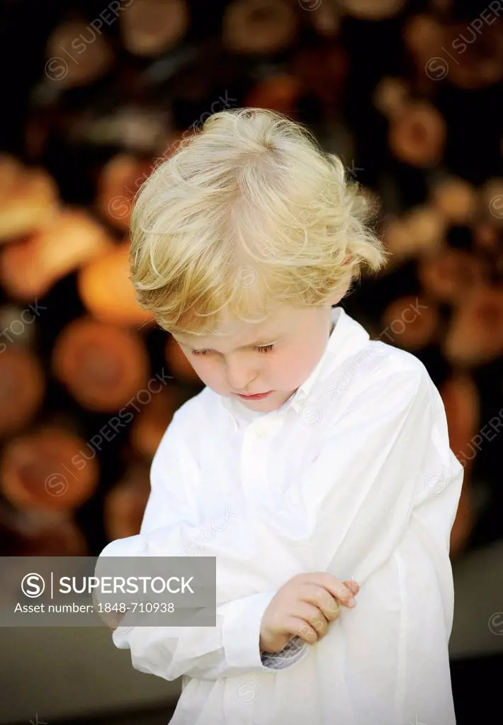 Sad five-year-old boy, looking down