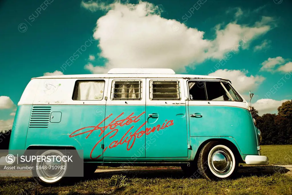 VW camper van, hippie bus, T1, 1960's, original turqouise and white colour, white wall tyres, elevating roof and inscription Hotel California