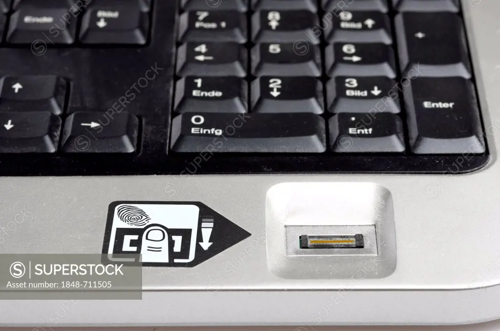 Computer keyboard with a fingerprint reader, only registered users can operate the computer after their fingerprint identifies them as an approved use...