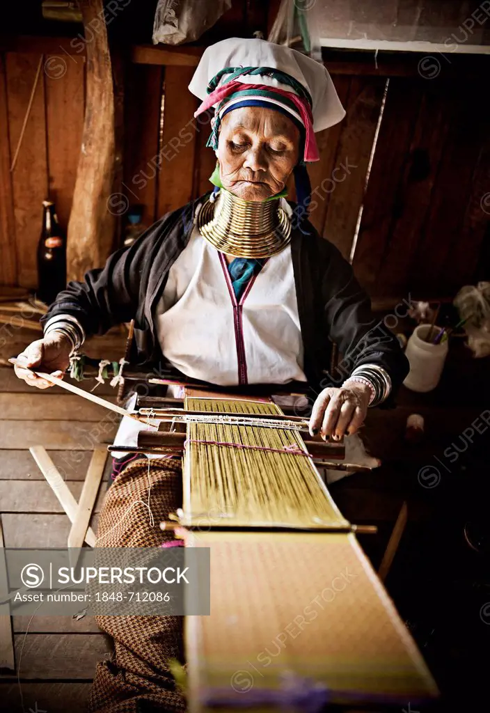 Old Kayan woman weaving, near Lake Inle, Burma also known as Myanmar, Southeast Asia, Asia