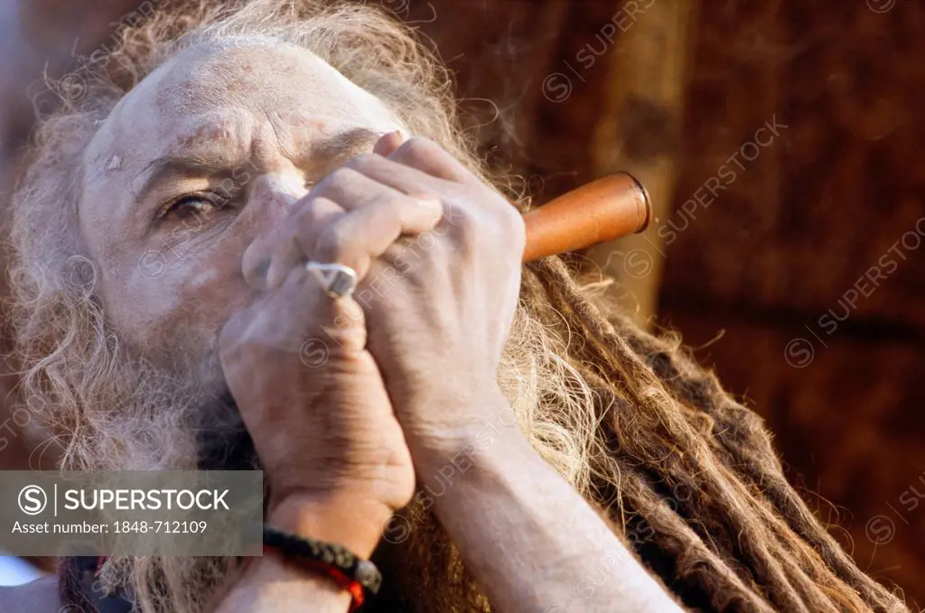 Smoking Ganja is illegal, but Sadhus refer to Shiva to have been smoking too, Varanasi, Uttar Pradesh, India, Asia