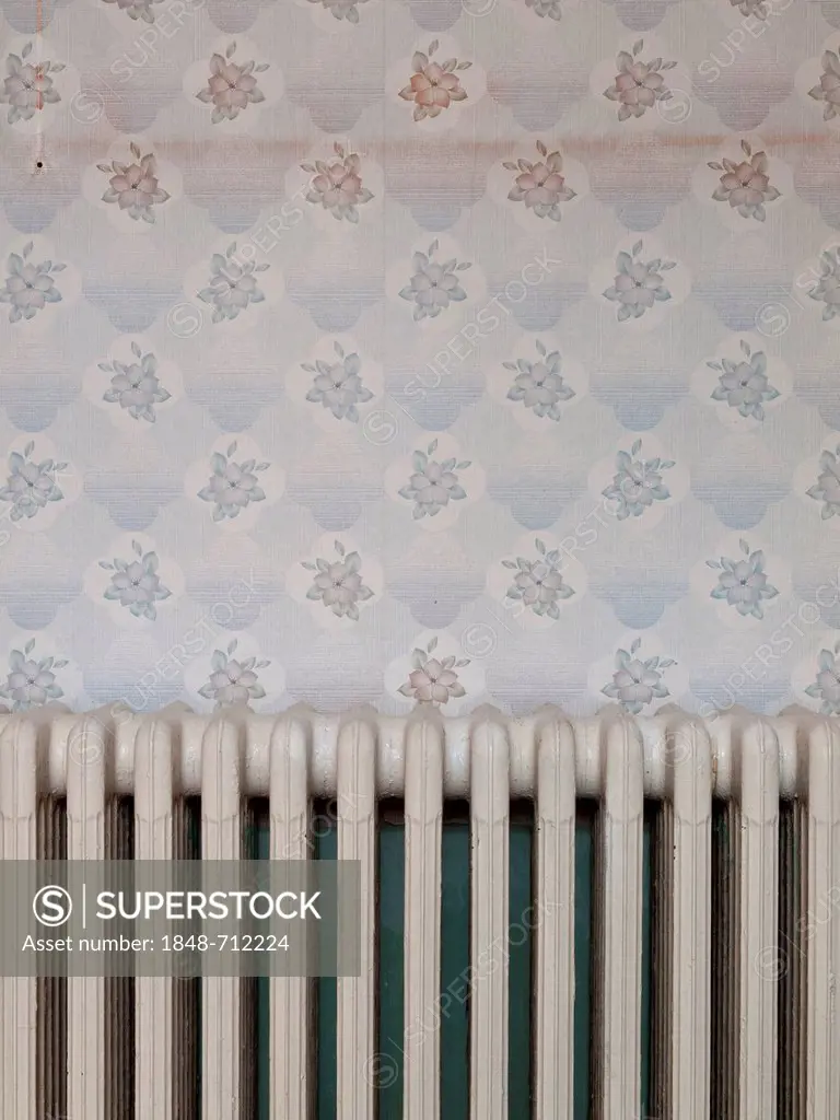 Radiator and old wallpaper