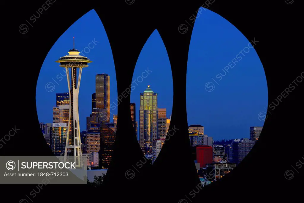 View through steel sculpture Changing Form by Doris Chase, Kerry Park, of the skyline of the Seattle financial district with Space Needle, full moon, ...