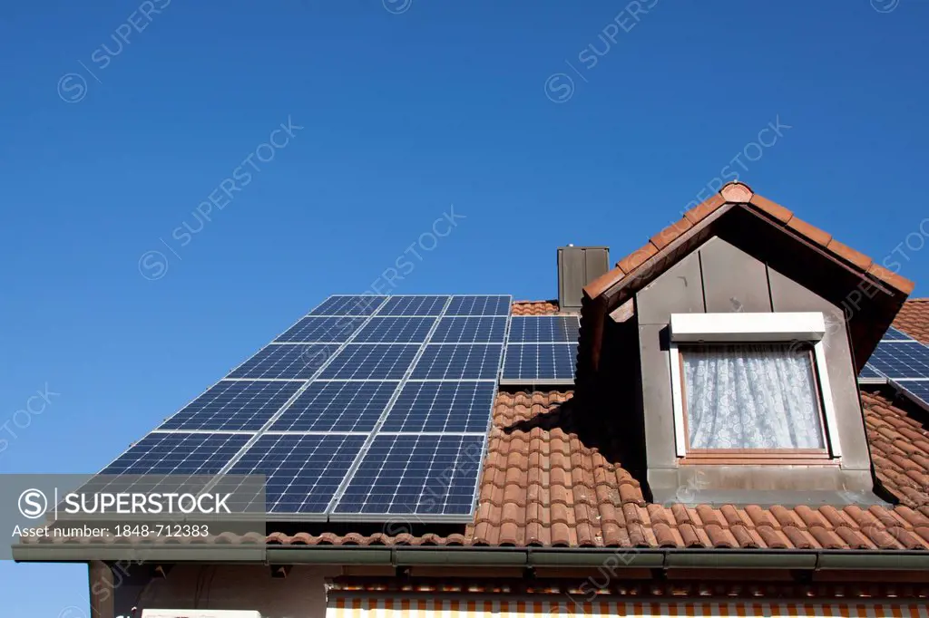 Solar panels on a house roof, photovoltaic