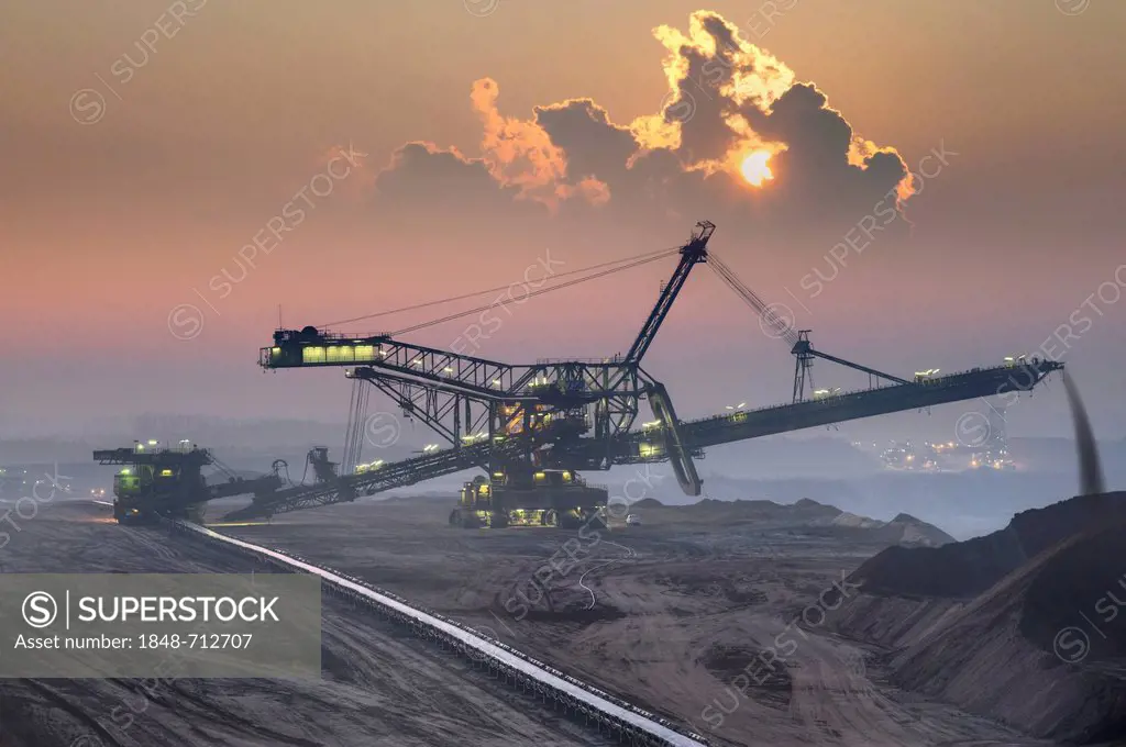 Spreaders in an open-cast lignite mine in the early morning, Garzweiler, North Rhine-Westphalia, Germany, Europe