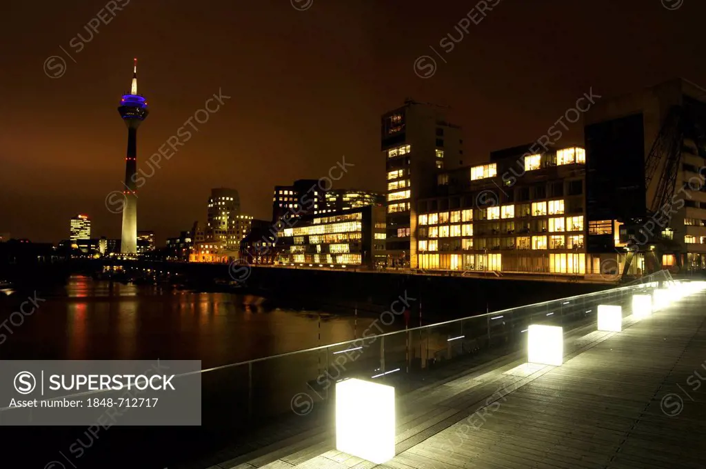 Duesseldorf's Medienhafen, with the Gehry buildings and Rheinturm tower at night, Duesseldorf, North Rhine-Westphalia, Germany Europe