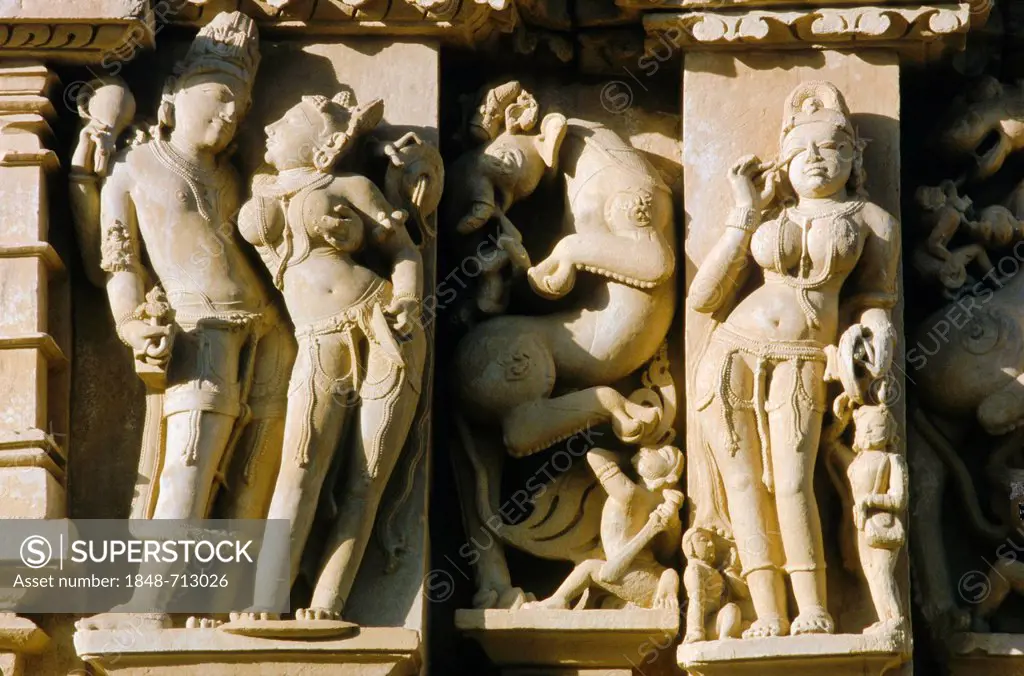 Stone carvings with scenes from Kamasutra, Khajuraho temples, Khajuraho, Madhya Pradesh, India, Asia