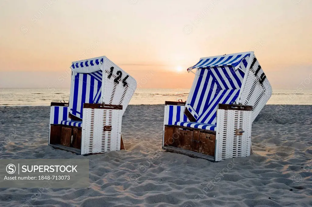 Roofed wicker beach chairs on the beach at sunset, List, Sylt, Schleswig-Holstein, Germany, Europe