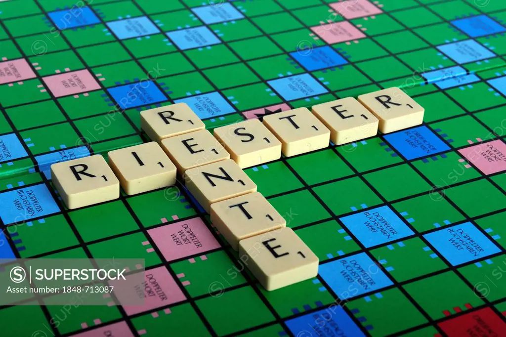 Scrabble letters forming the words Riester and Rente, German for the Riester pension
