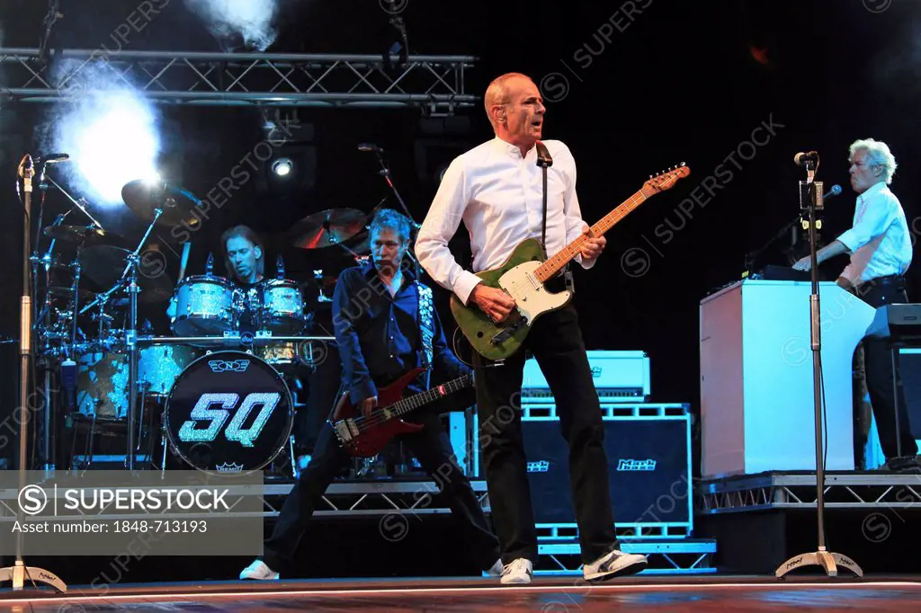 Francis Rossi, in the foreground, performing with his band Status Quo, Freilichtbuehne Junge Garde outdoor stage, Dresden, Saxony, Germany, Europe