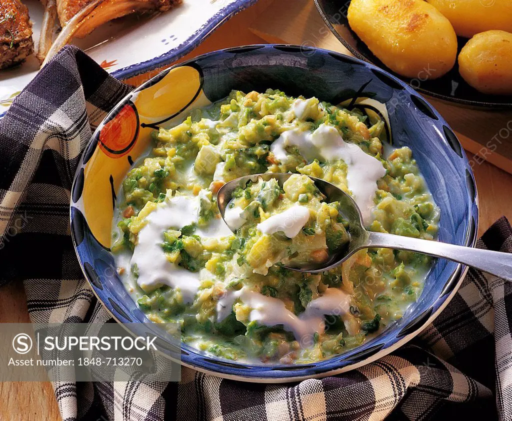 Creamy savoy cabbage with peanuts and double cream, whole food cuisine, Switzerland